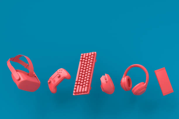 istock Flying gamer gears like mouse, keyboard, joystick, headset, VR on blue and pink 1337379537