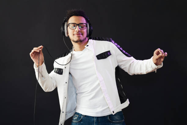 istock Carefree dark skinned guy listens lively music 1337379893