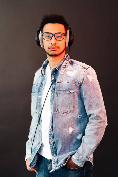 istock Carefree dark skinned guy listens lively music 1337379944