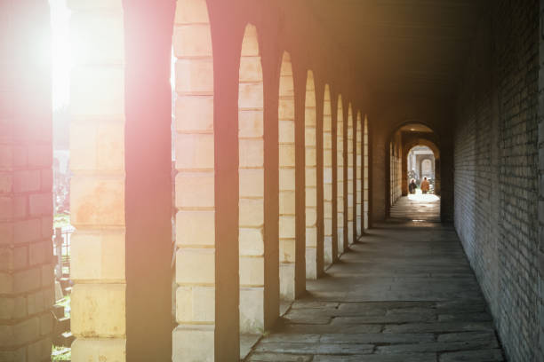 Sun Flare through European Roman Columns Historic Brown Bright