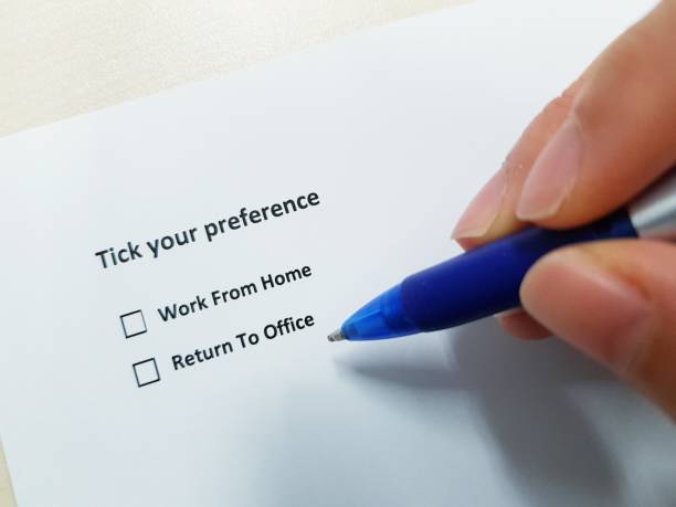 istock Deciding between wfh working from home and return to office during covid-19 pandemic 1337380934