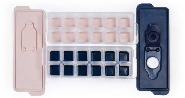 istock Ice cube trays different colors and removed lids, top view 1337380936