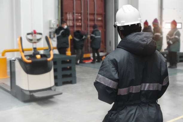 istock Hand of worker with clipboard checking ready meals goods in the warehouse., Import and export management system for customer service concept. 1337381215