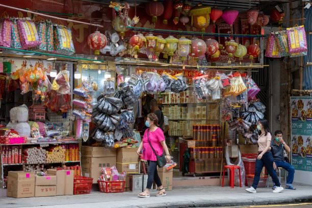 Paper offerings store in Queen's Road West, Sai Ying Pun, Hong Kong Hong Kong - August 30, 2021 : People at the paper offerings store in Queen's Road West, Sai Ying Pun, Hong Kong. chinese-funeral stock pictures, royalty-free photos & images