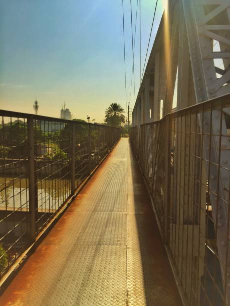 istock Beauty Rainbow light shines over the long bridge. 1337383390