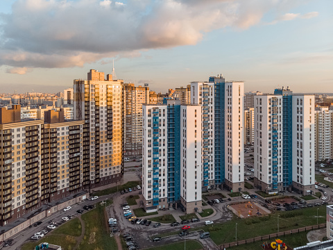 Сlose location of multistorey buildings. Modern tall living dwellings in Russia. Saint Petersburg. Aerial view.