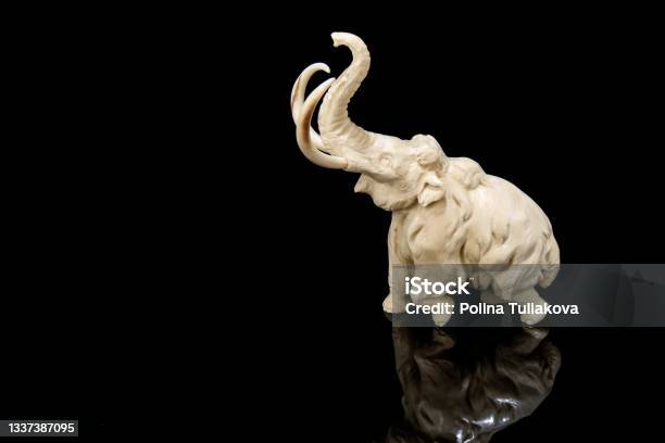 Ivory Statuette Of Elephant Mammoth On Black Background Stock Photo - Download Image Now