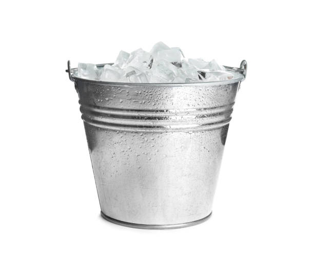 Metal bucket with ice cubes isolated on white Metal bucket with ice cubes isolated on white bucket stock pictures, royalty-free photos & images