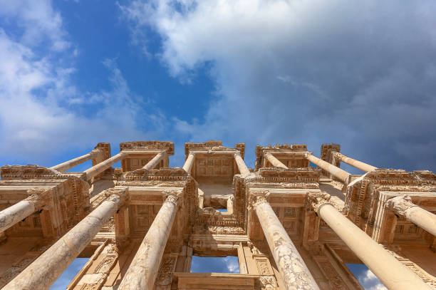 Selcuk, Izmir, Turkey - 09.23.2024: Ancient city of Ephesus. Tourists in the Library of Celsus. The ruins of a library in Ephesus. UNESCO world heritage list destinations in Turkey