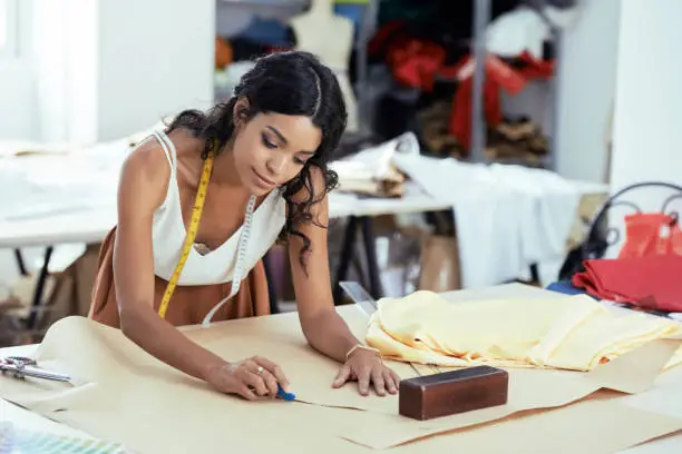 Photo of Garment Designer Working on Pattern