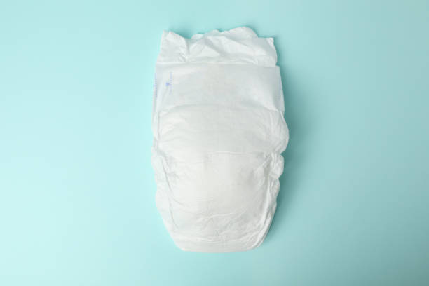 istock Baby diaper on light blue background, top view 1337399756