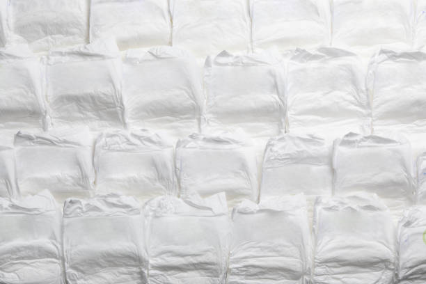 istock Baby diapers as background, top view. Child's garment 1337399873