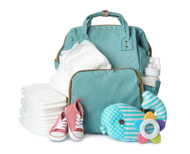 istock Backpack with disposable diapers and child's accessories on white background 1337401614