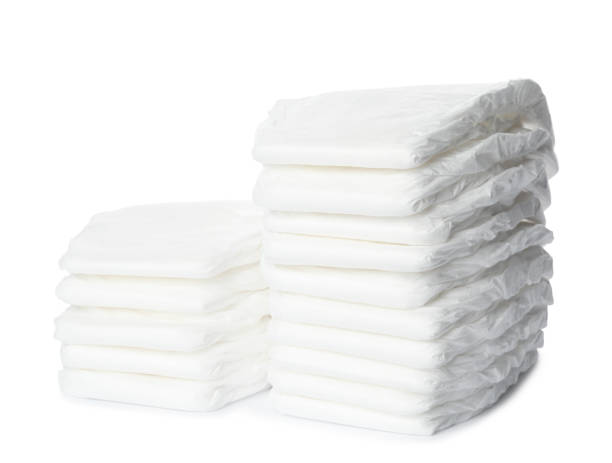 istock Stacks of baby diapers isolated on white 1337401628