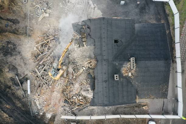 istock Yellow excavator destroys building 1337401637