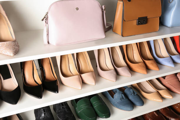istock White shelving unit with different leather shoes and bags 1337401676