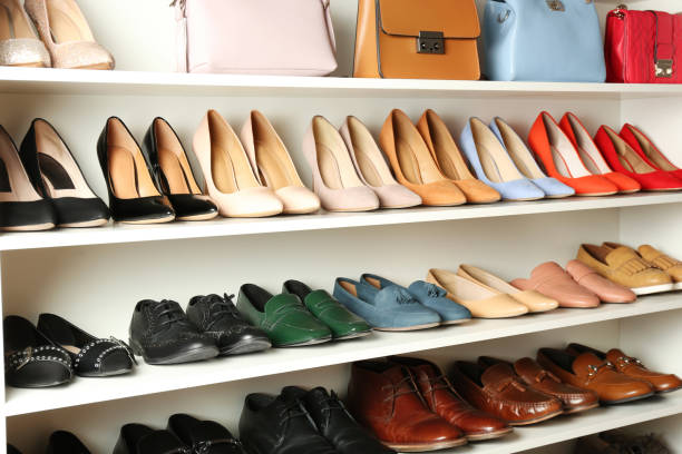istock White shelving unit with different leather shoes and bags 1337401754