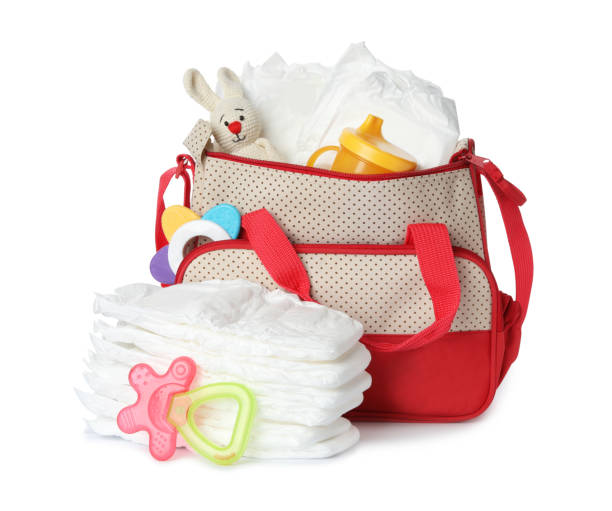 istock Maternity bag with disposable diapers and child's accessories on white background 1337401886