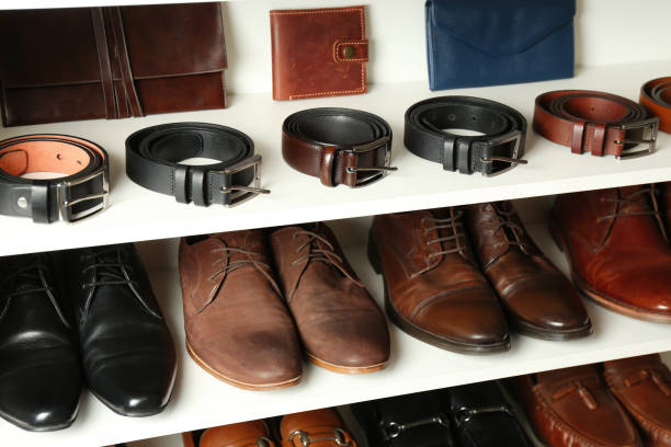 istock White shelving unit with different leather shoes and accessories 1337404939