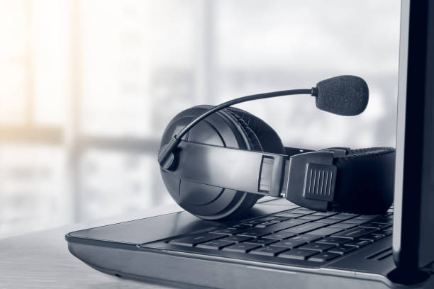istock VOIP headset on laptop keyboard concept for communication, it support, call center and customer service help desk 1337405702