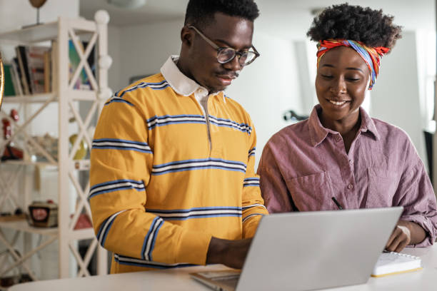 istock A young couple using laptop together 1337405959