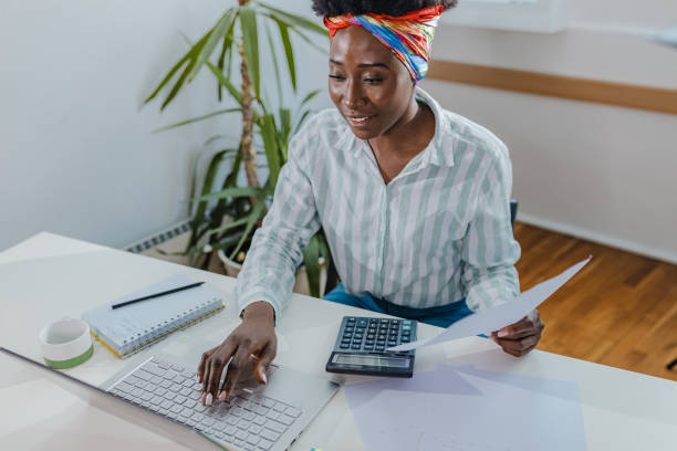 istock Young woman holds a document in her hand and works from home 1337405961