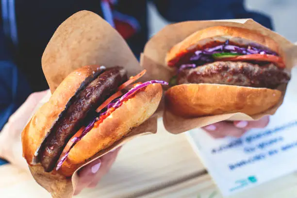 Photo of Pljeskavica, traditional serbian dish, grilled dish of spiced meat patty mixture of pork, beef and lamb, popular balkan street food Pleskavitza