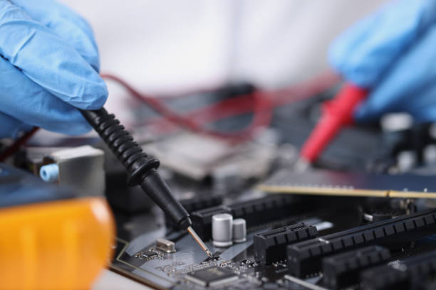 istock Master in gloves with equipment is testing computer motherboard 1337410484