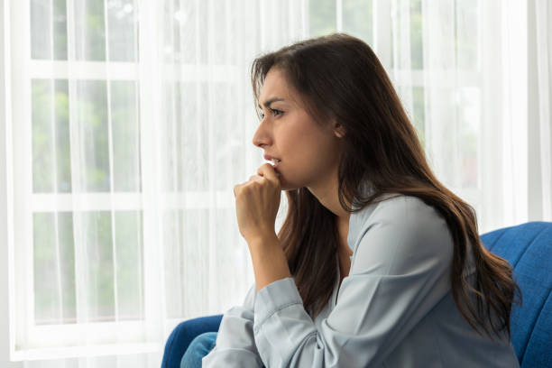 istock caucasian woman psychological problem feeling anxiety depression. Her face showed Sad and worried. Unhappy and thinking of grief troubled with different problems in life. difficult period 1337411949