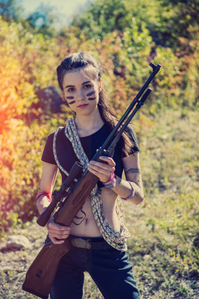 istock Hunter with rifle posing outdoor 1337412173