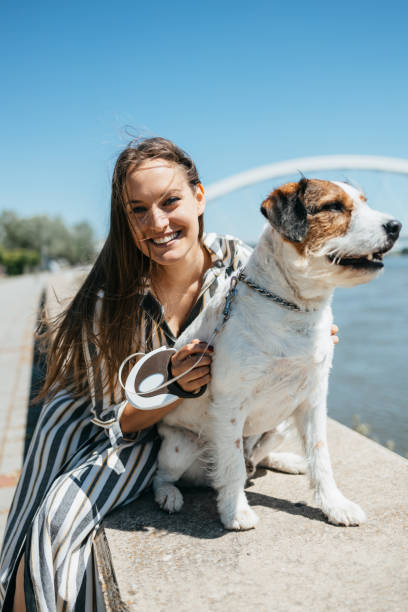 istock Beautiful young woman with adopted dog 1337413300