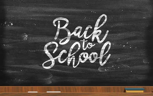 Education concept against black board with Back to school text. Educational concept. Easy to crop for all your design and print needs.
