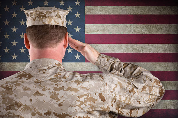 istock Marine Salutes an American Flag 133741616