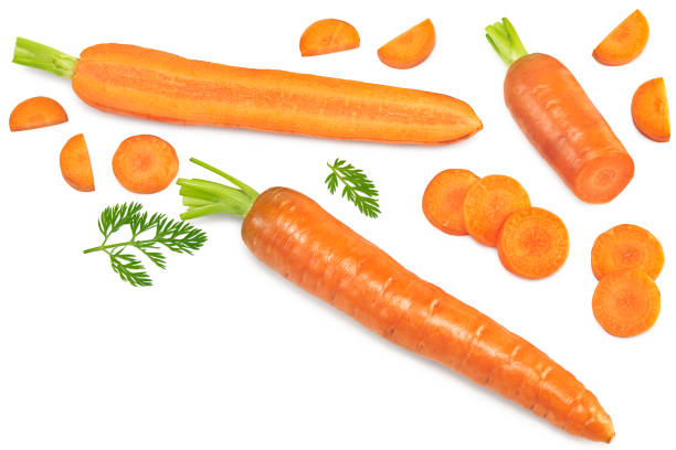 istock sliced carrot with green leaves isolated on white background. clipping path. top view 1337416885