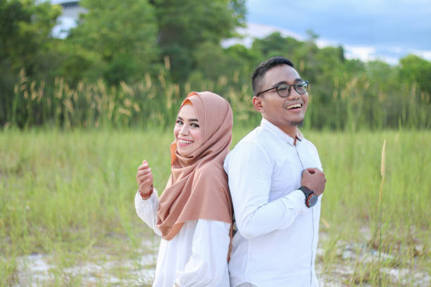 Portrait of young couple in romantic and sweet moment Portrait of young couple in romantic and sweet moment in an outdoor garden malay couple stock pictures, royalty-free photos & images