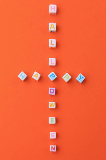 istock Happy halloween lettering. Vertical cross text 1337418955