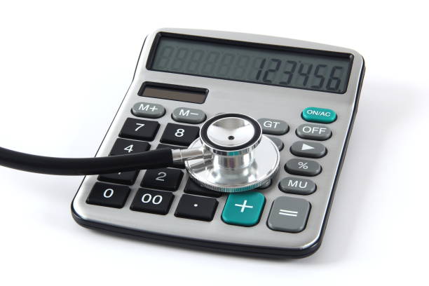 istock Stethoscope and calculator on white background 1337419836