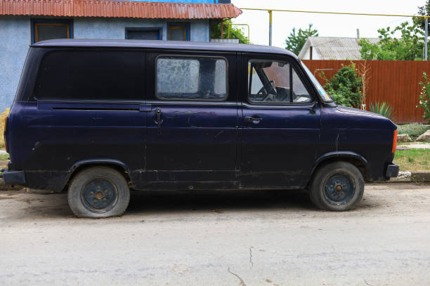 istock Old broken abandoned retro van on a village street. 1337420049