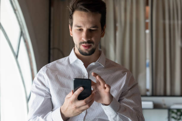 istock Caucasian businessman use cellphone texting online on gadget 1337424333