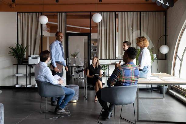 istock Multiethnic businesspeople talk discuss ideas at meeting 1337424347