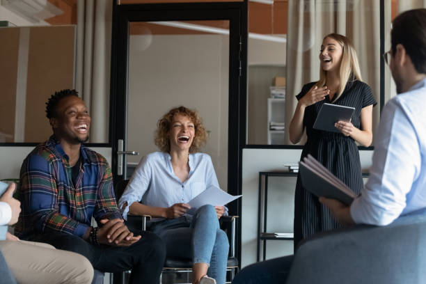 istock Smiling multiethnic colleagues laugh talking at meeting 1337424351
