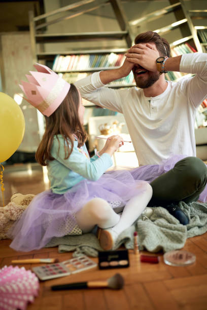 istock A young father and his little daughter having a good time while they preparing for a ballet training at home. Family, together, home 1337427046