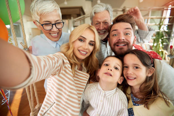 istock Three generation family having a good time while taking a selfie at home together. Family, leisure, together 1337427140