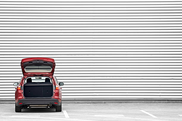 Ready to load Red station wagon with trunk opened parked before a shopping mall wall trunk stock pictures, royalty-free photos & images