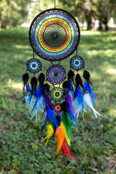 istock Handmade dream catcher with feathers threads and beads rope hanging 1337428491