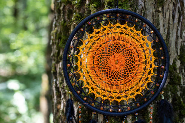 istock Handmade dream catcher with feathers threads and beads rope hanging 1337428492