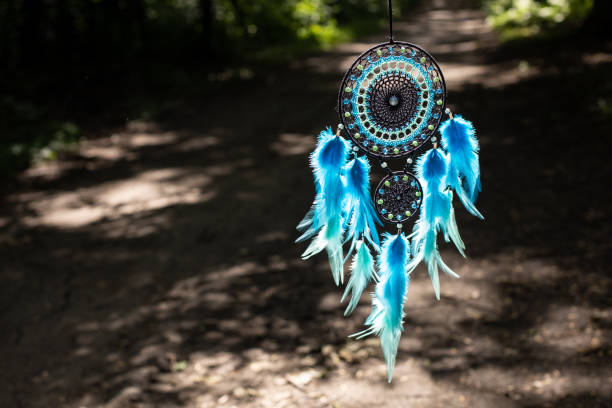 istock Handmade dream catcher with feathers threads and beads rope hanging 1337428503