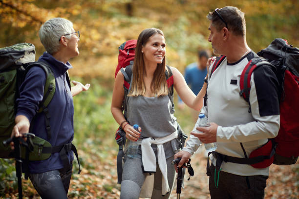 istock Friends having a nice talk at a break from hiking 1337431128