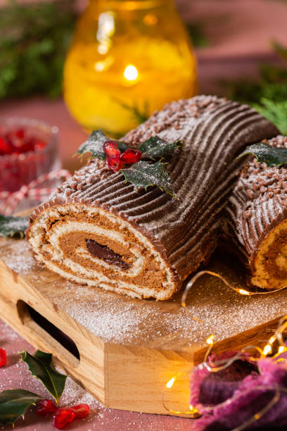 istock Traditional Christmas cake, chocolate Yule log with festive decorations 1337431416