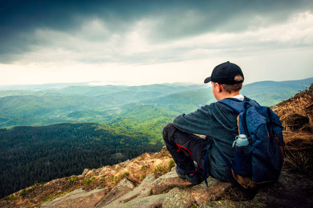 istock Teenage boy in the mountains 1337431545